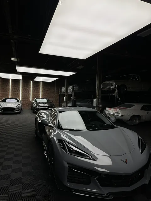 Silver Corvette inside Clubhouse Garage’s detailing studio